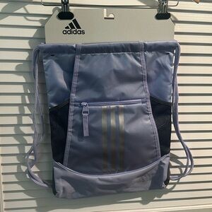 NWT Adidas Athletic Pull string bag with side and front pockets.
